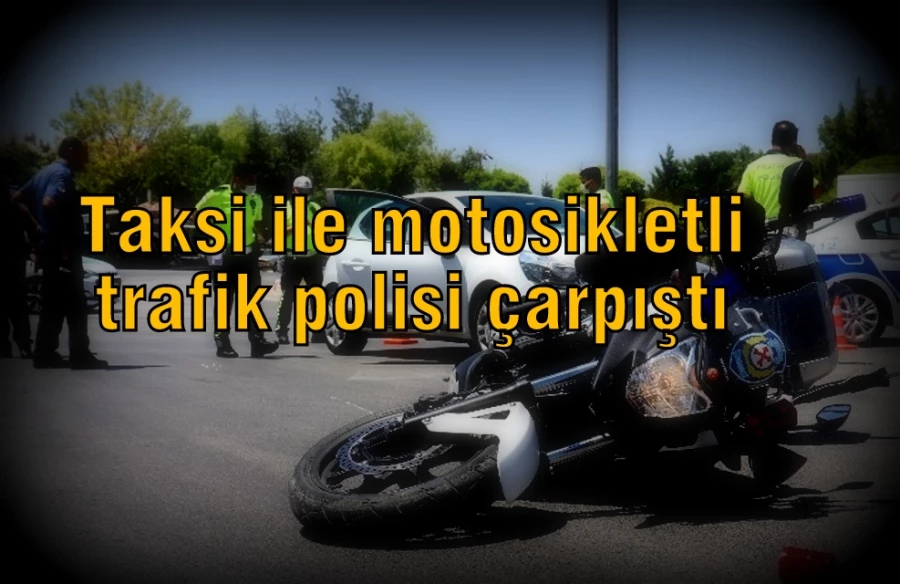 Taksi ile motosikletli trafik polisi çarpıştı